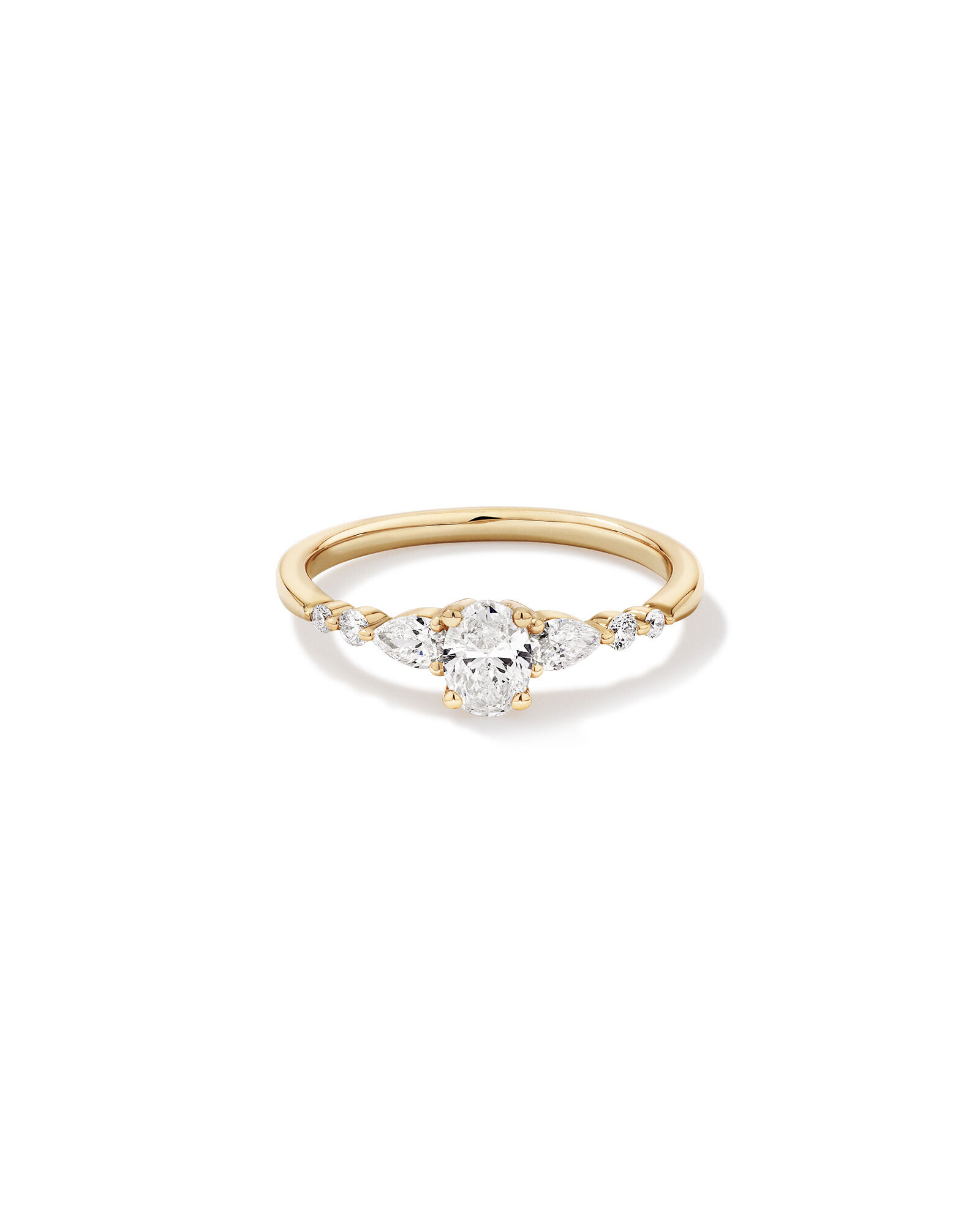 0.59 Carat TW Oval and Pear Sidestone Engagement Ring in 14kt Yellow Gold