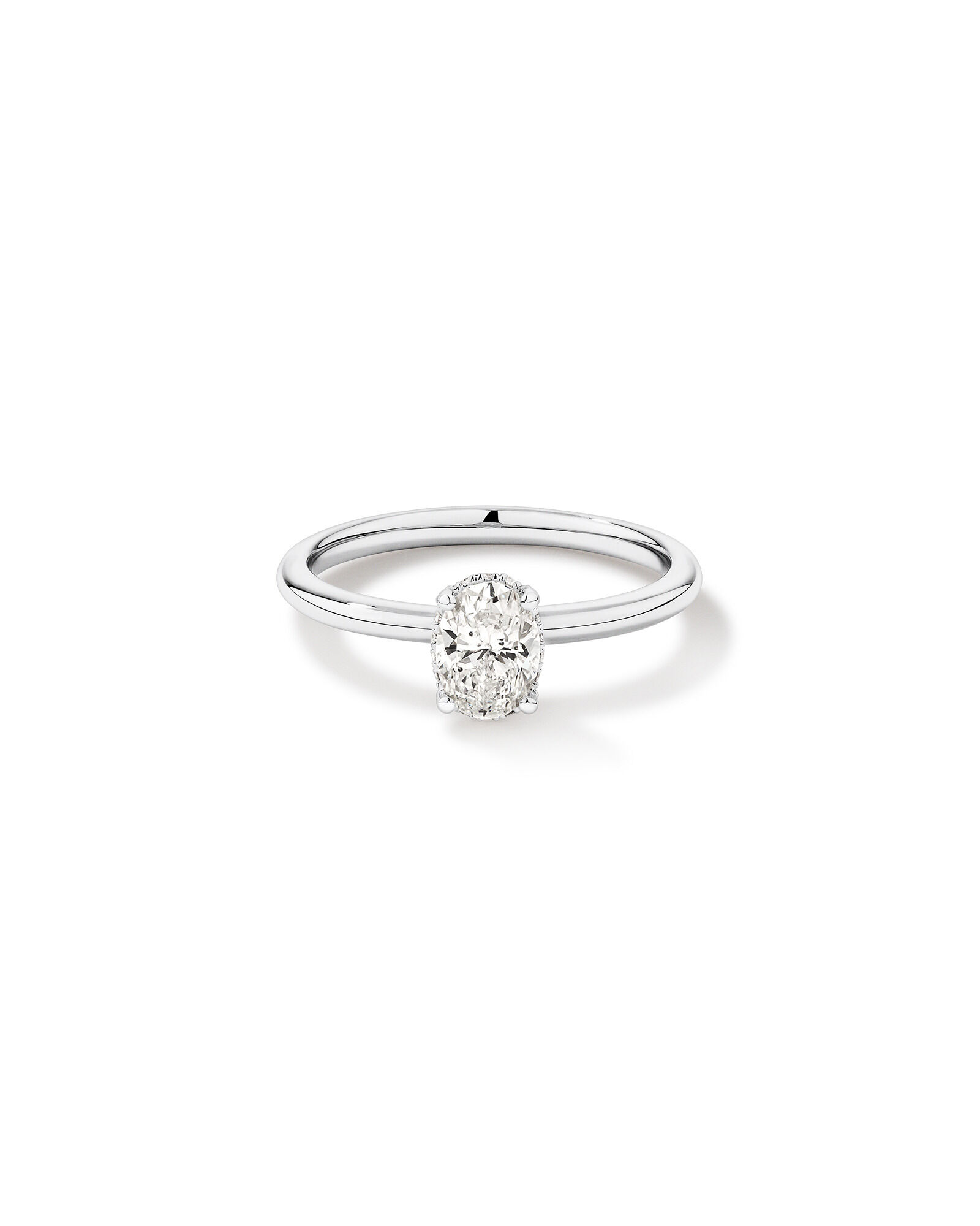 0.68 Carat TW Oval Cut Diamond Solitaire Hidden Pave Halo Engagement Ring in Platinum